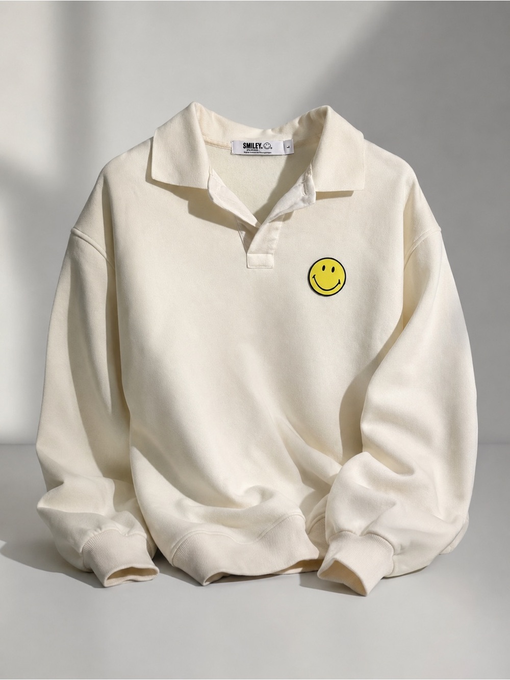 Smiley Co. Cream Polo Sweatshirt with Yellow Smiley Patch